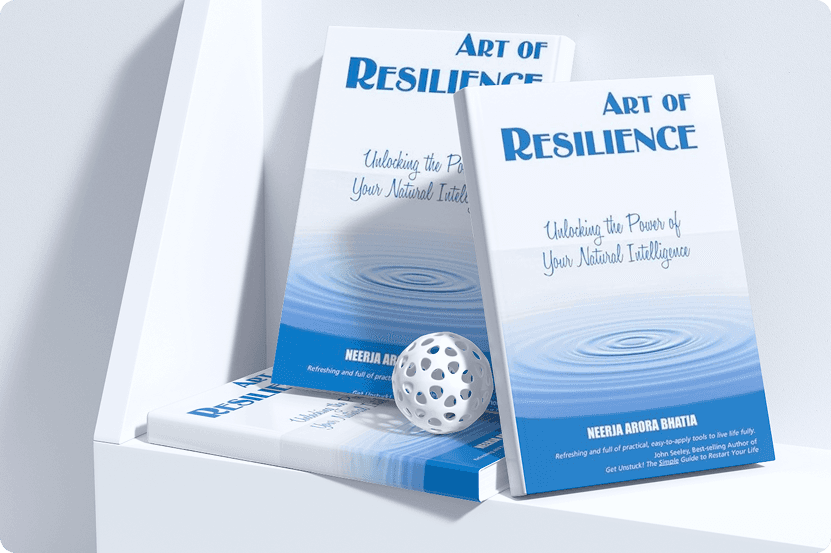 Three books titled 'Art of Resilience' with blue and white covers placed on a white shelf with a white spherical decorative object